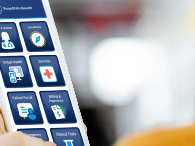 Person holding white smartphone showing mobile apps 