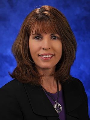 Kelly Altland, in a professional head and shoulders photograph.