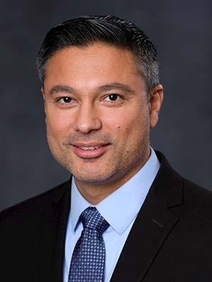 Amit Sareen, professional head and shoulders photograph.