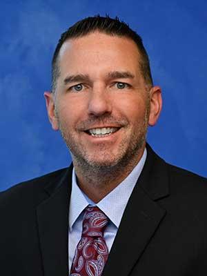 Dr. Jonathan Anson in a professional head and shoulders photograph.