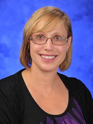 Susan Brennan, in a professional head and shoulders photo.