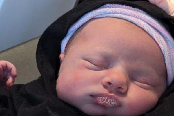 Close-up image of a newborn infant.