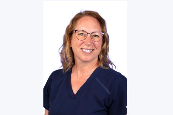 Young female posing with a smile on her face.