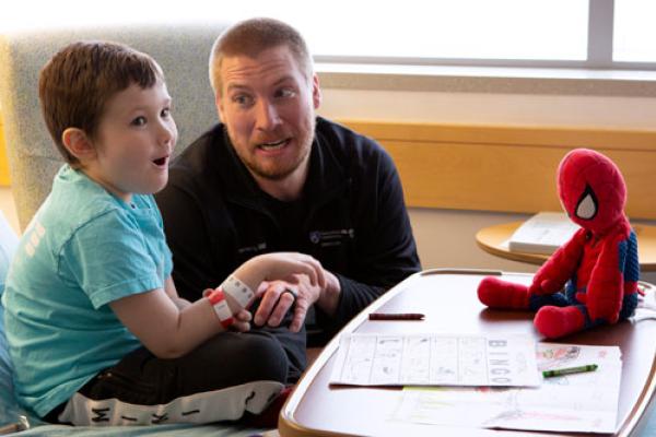Father and son playing a game of virtual bingo
