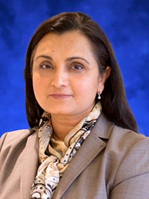 Mumtaz Darbar, in a professional head and shoulders photograph.