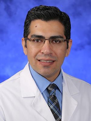 Umar Farooq, in a professional head and shoulders photograph.