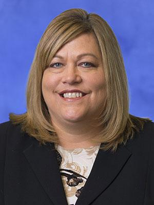 Kim Feeman, in a professional head and shoulders photograph.
