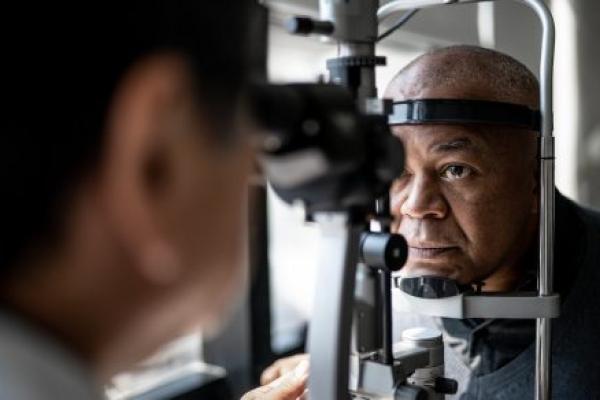 An ophthalmologist examines a patient’s eyes.
