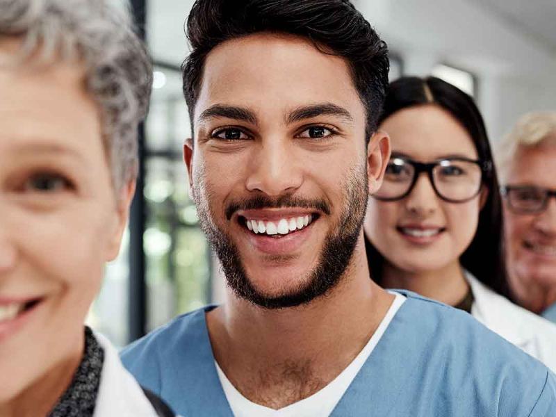 Portrait of a group of medical practitioners standing together in a hospital