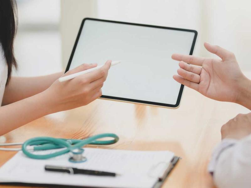Teal Stethoscope On Wooden Table