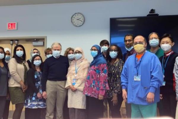 Eighteen members of the Division of Endocrinology, Diabetes and Metabolism stand for a group photo in the University Conference Center.
