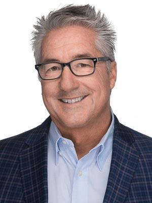 Mark Dambly in a professional head and shoulders photograph.