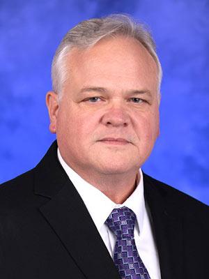 Peter Ostasewski in a professional head and shoulders photograph.