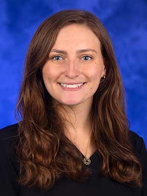 Abbigail Parsons, in a professional head and shoulders photo.