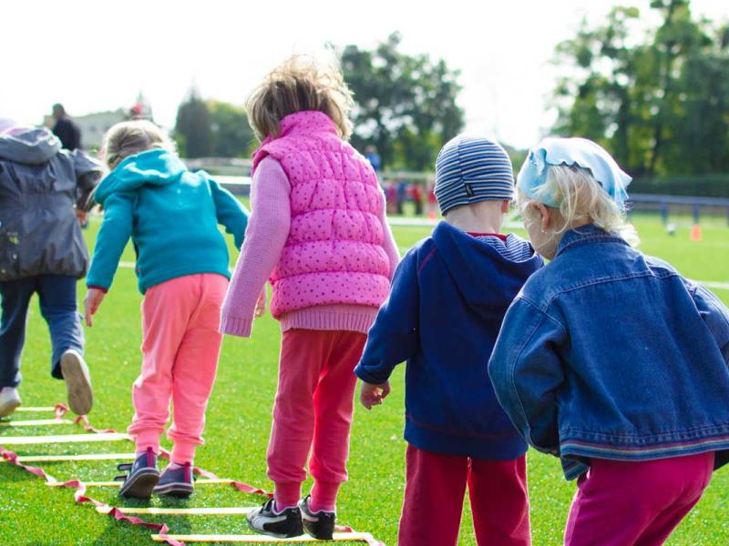 Children's Team Building on Green Grassland