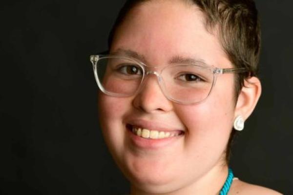 A closely cropped photo of a young girl's face.