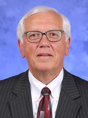 William Reed, in a professional head and shoulders photograph.