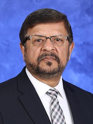 Amyn M. Rojiani, MD, in a professional head and shoulders photograph.