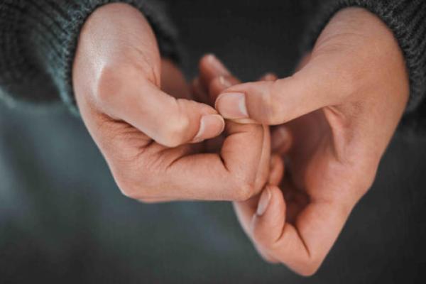 Close-up of a person holding their hands close together.