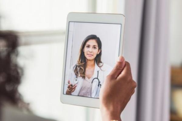A female doctor a female patient advice during a telemedicine appointment.
