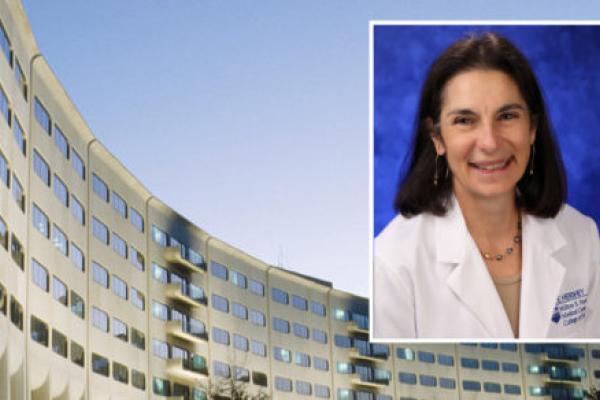 A head-and-shoulders professional portrait of Terry Wolpaw superimposed on an image of the exterior of Penn State College of Medicine