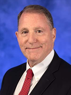 Kenneth Wood, in a professional head and shoulders photograph.