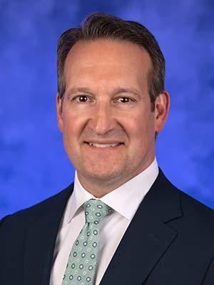 Sean Young, in a professional head and shoulders photograph.