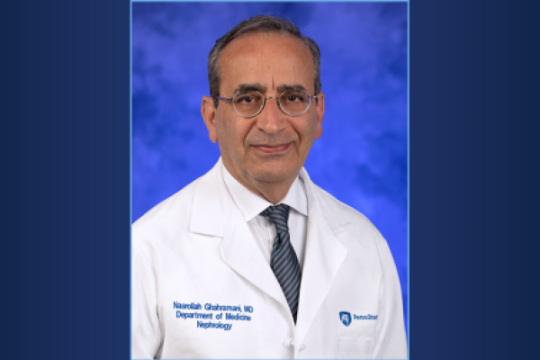 Portrait of Dr. Nasrollah Ghahramani in doctor's coat, on a gradient background